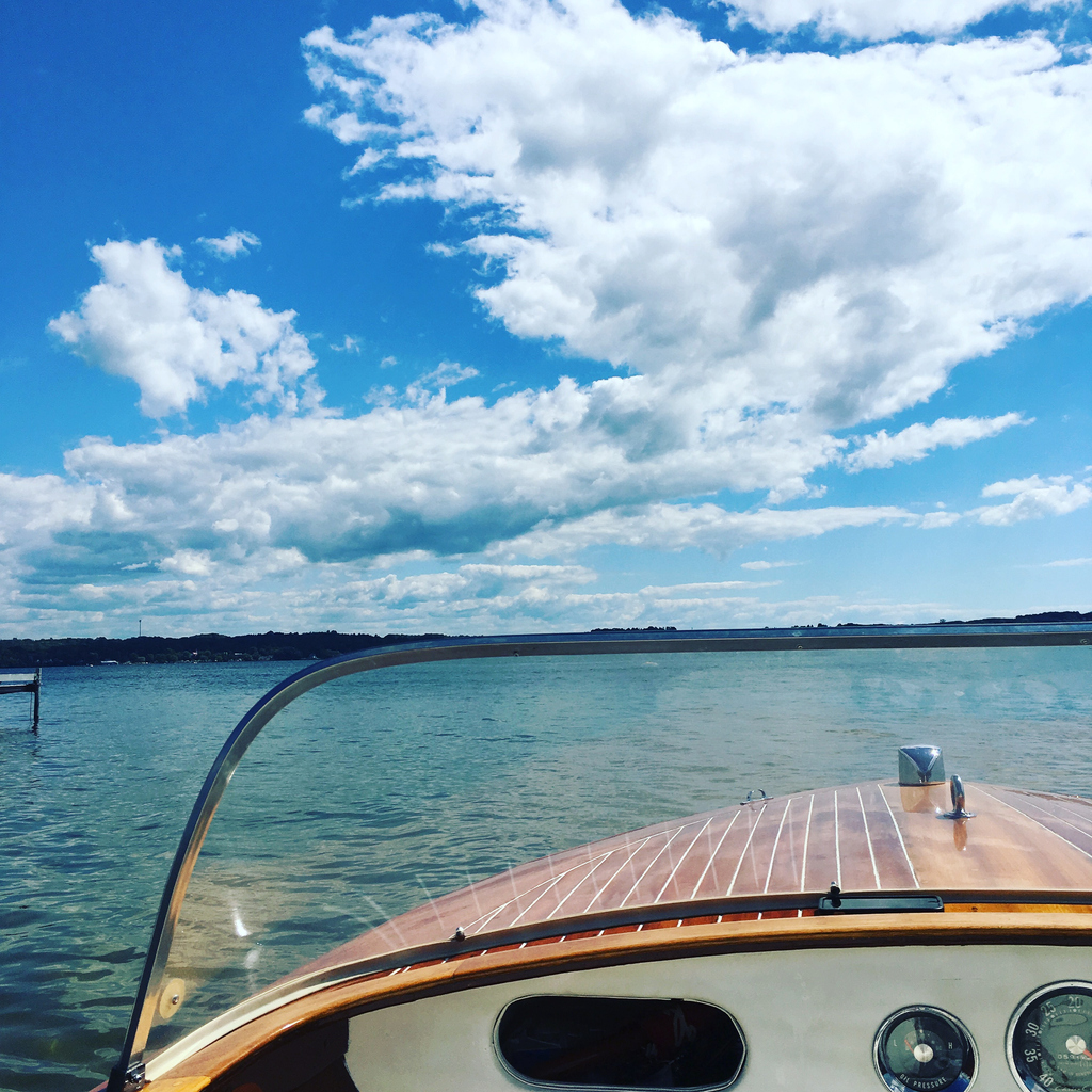 Front of a boat on a lake, providing context for the protection offered by boat insurance.