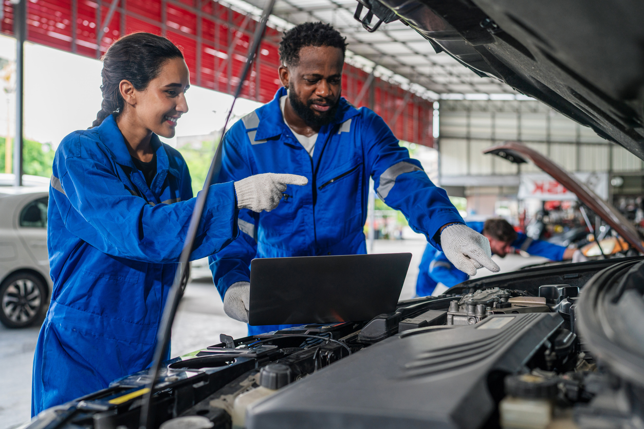 Team Auto mechanic are checking and repair maintenance auto engine